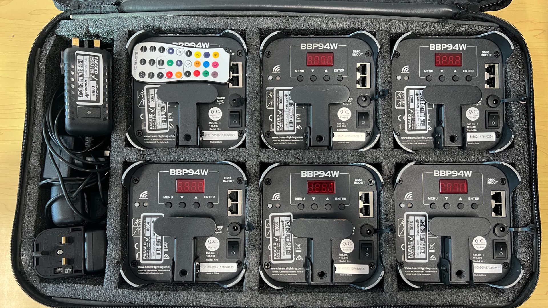 A case of tested uplighters ready for use